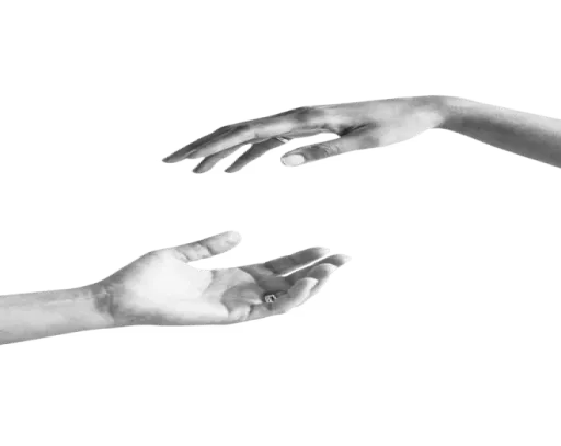 Two hands reaching toward each other